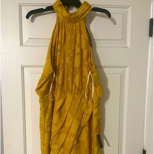 Beautiful Lulu’s canary yellow, tulip- hemmed dress.